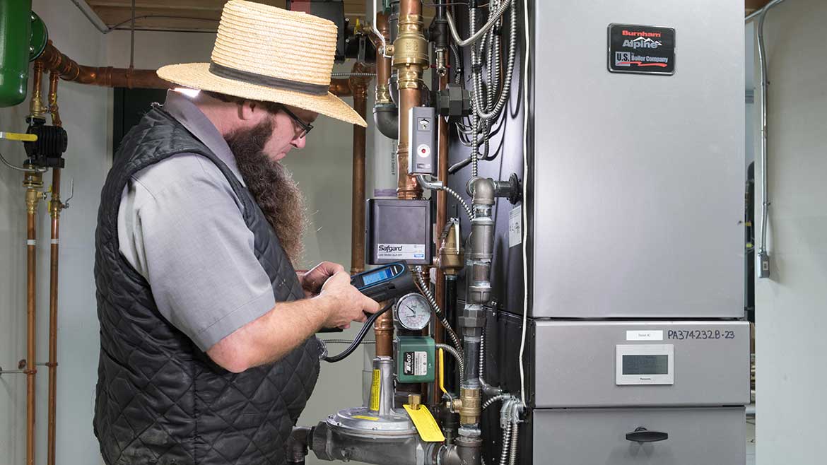 08 PM Feb 2024 Keystone Air Power. Henry King, owner of Pleasant View Plumbing & Heating, checks the system to make sure it is running effieciently.