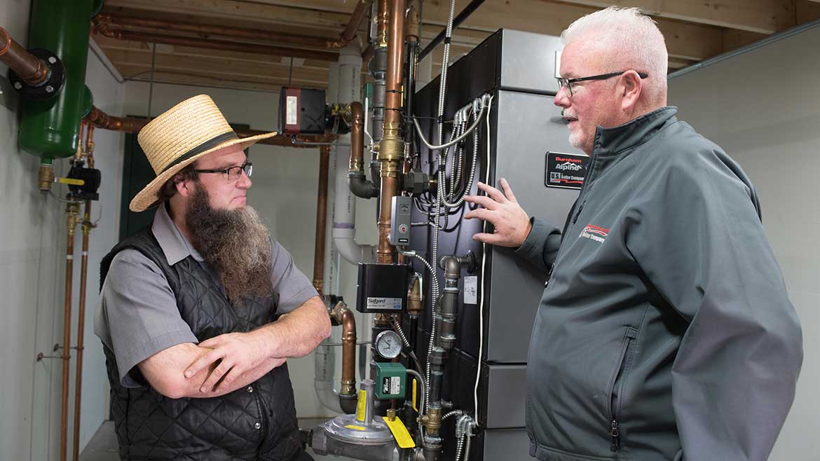 09 PM Feb 2024: Henry King, owner Pleasant View Plumbing & Heating (left) with ROI Marketing's Dave Raabe (right) in the new mechanical room of Keystone Air Power.